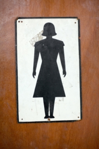 antique woman's toilet icon symbol on washroom door